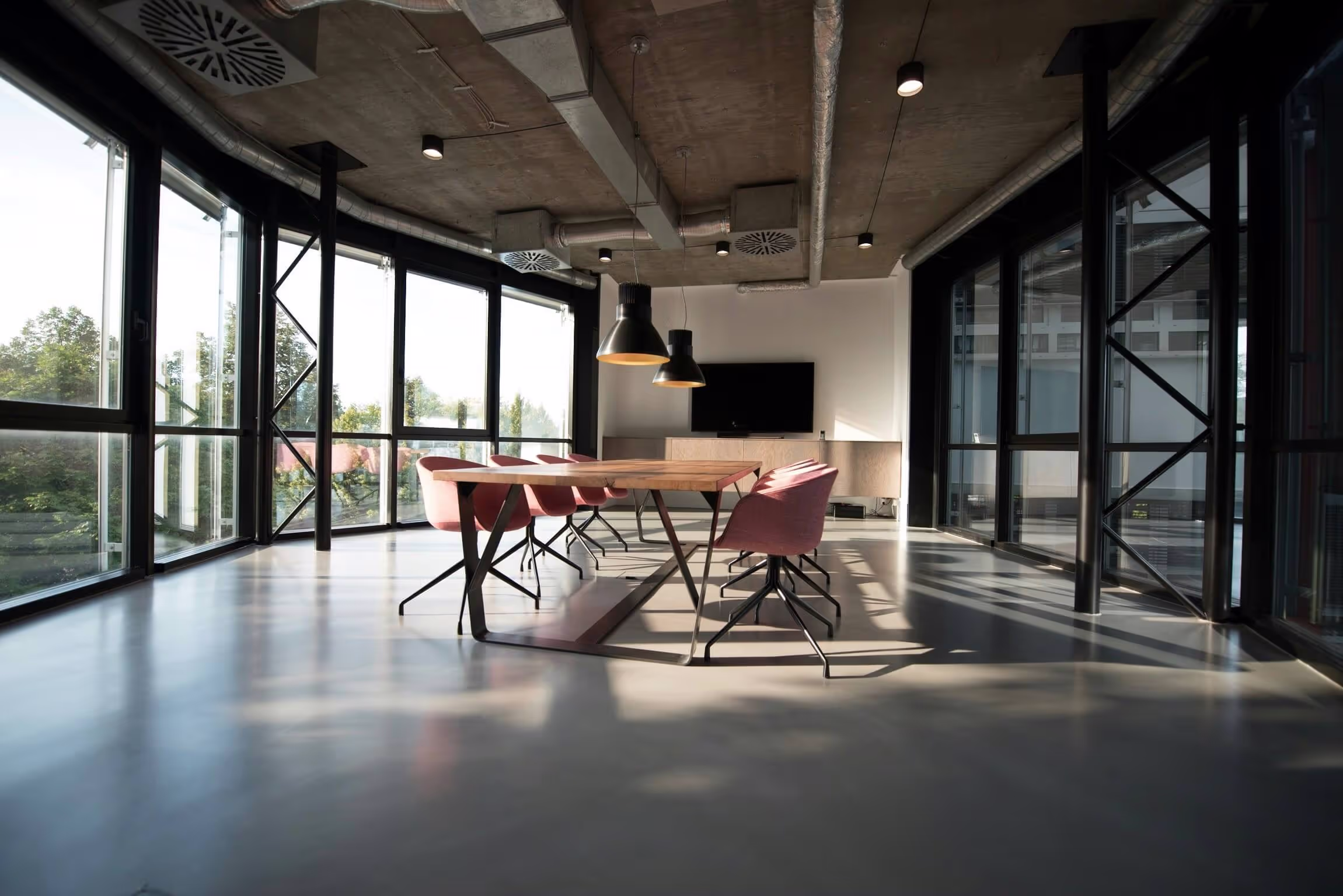 Open-plan office space with mechanical ventilation ductwork in London